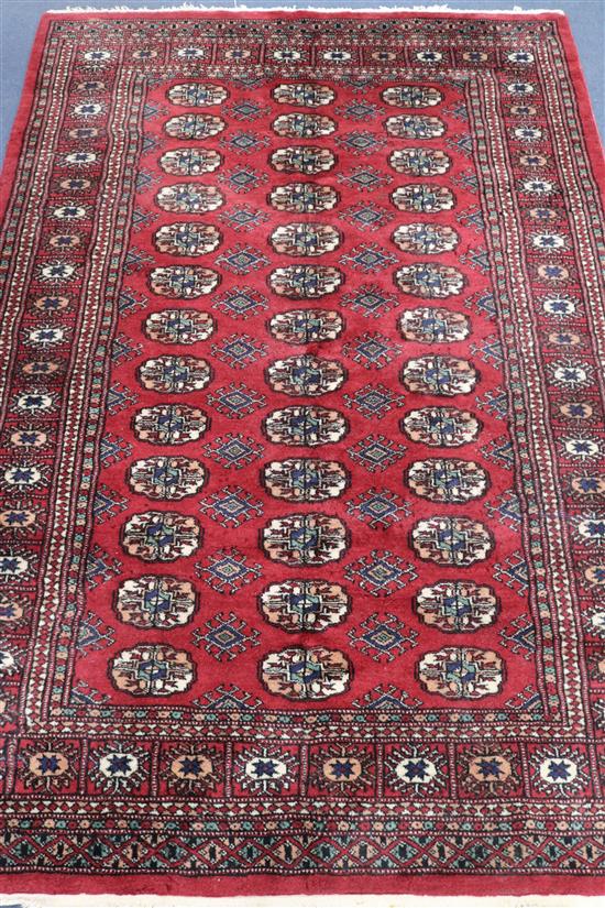 A red ground Bokhara style rug, 185 x 125cm